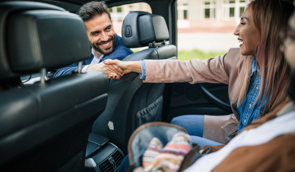 Auto Consultant shaking hands with member